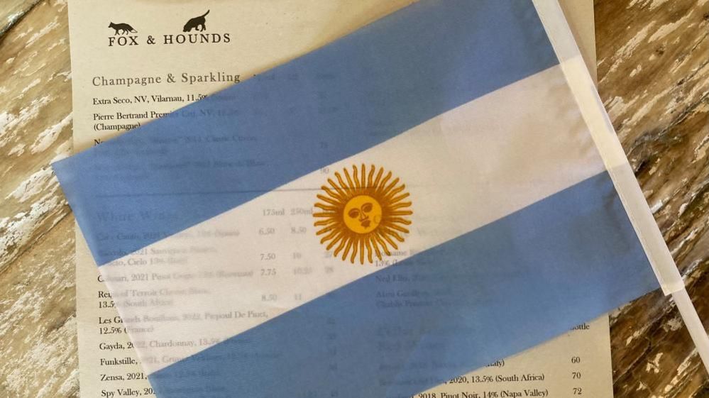 Argentinian flag lying on pub menu