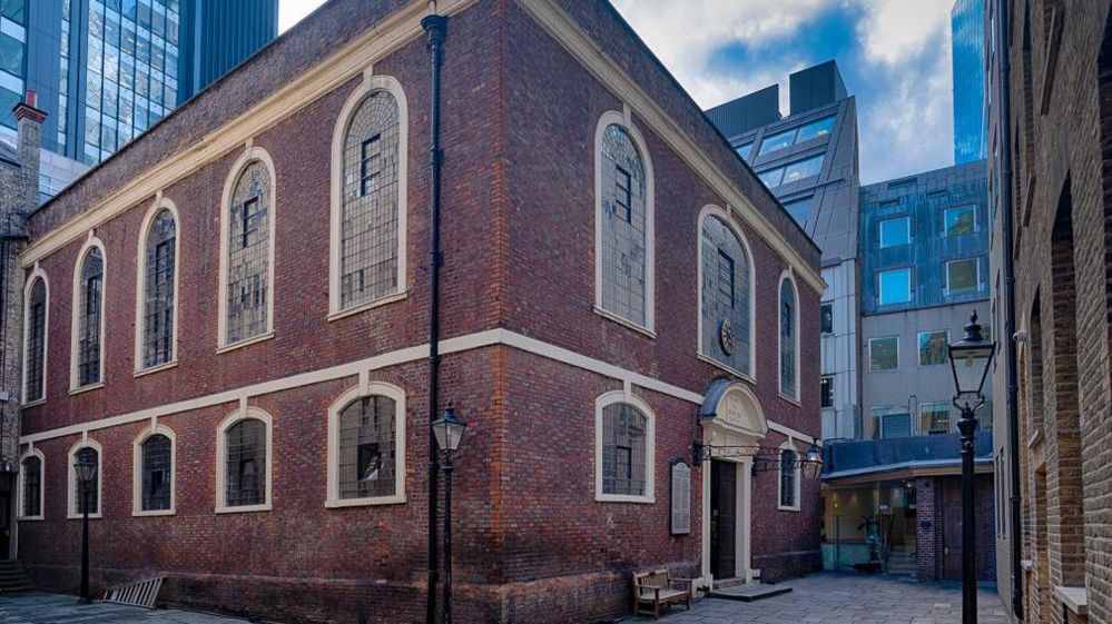 A general view of the synagogue, with office tower blocks in the background