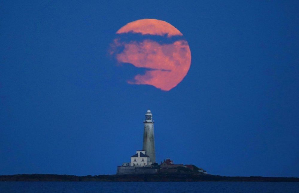 The Full Buck supermoon rises over St Mary's Lighthouse in Whitley Bay on 2 July