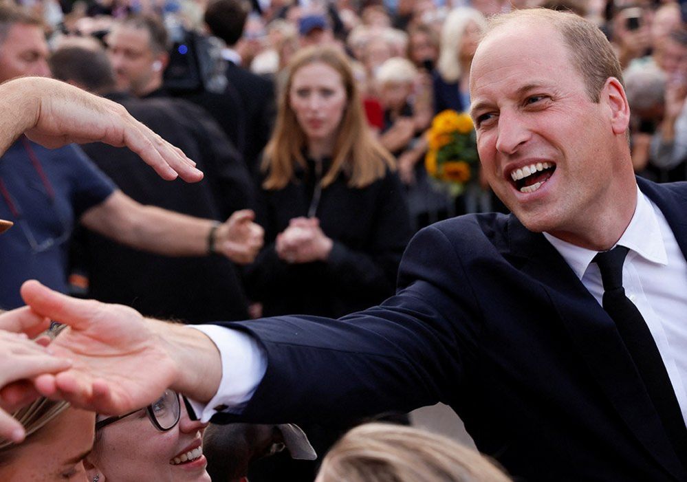 Prince William greets people outside Windsor Castle
