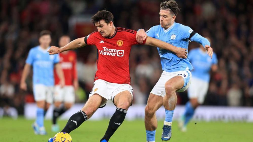 Harry Maguire and Jack Grealish in Premier League action