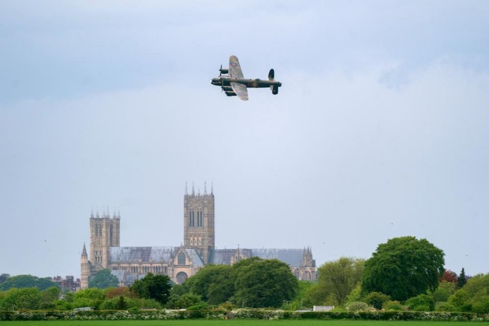 Lancaster bomber passes over Lincoln Cathedral