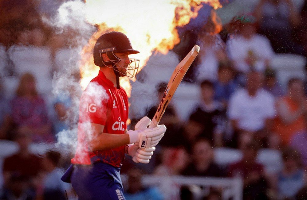 England's Will Jacks as fire sprays behind him as part of a display, 5 September 2023