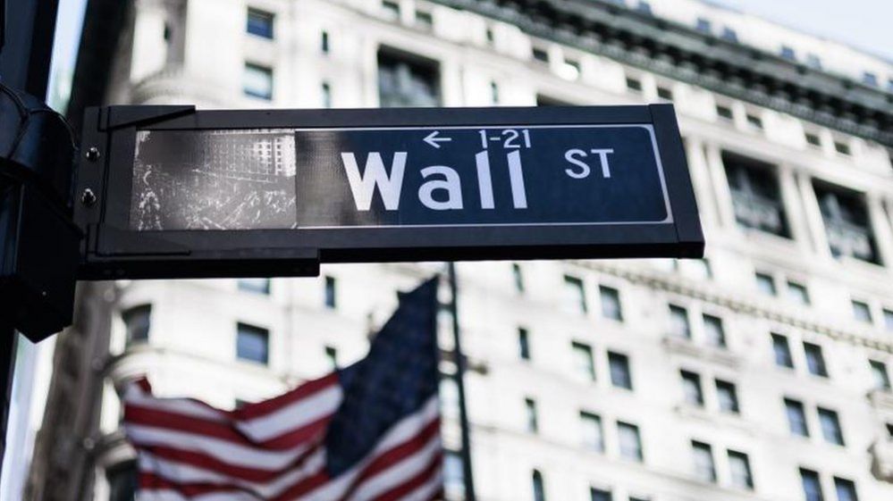 A sign for Wall Street outside the New York Stock Exchange in Manhattan, New York City