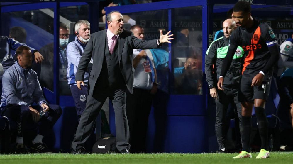 Everton boss Rafael Benitez gestures to his team during their match at QPR