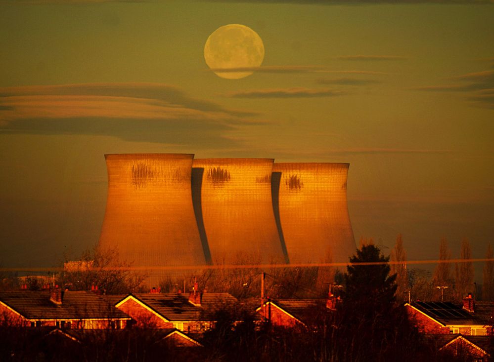 The Moon sets behind Ferrybridge Power Station in West Yorkshire
