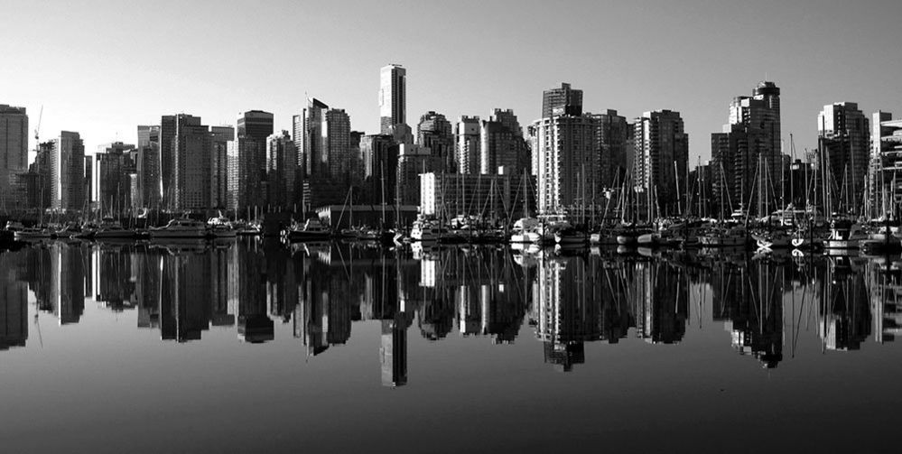 Skyscrapers of Vancouver reflected in the bay