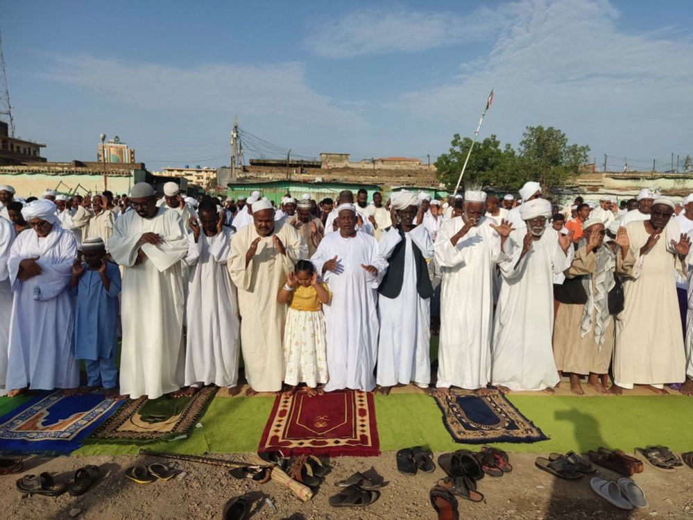 Muslim worshippers perform the Eid al-Adha morning prayer in Sudan's eastern Gedaref region
