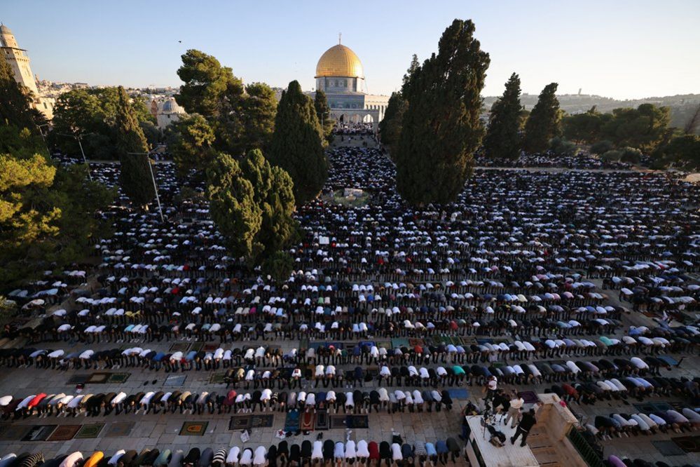 Muslim worshippers gather at the al-Aqsa mosque compound in Jerusalem to perform Eid al-Adha morning prayers