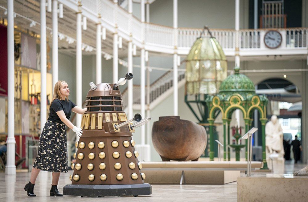 Member of staff Liv Mullen with a Dalek during a photocall at the National Museum of Scotland in Edinburgh