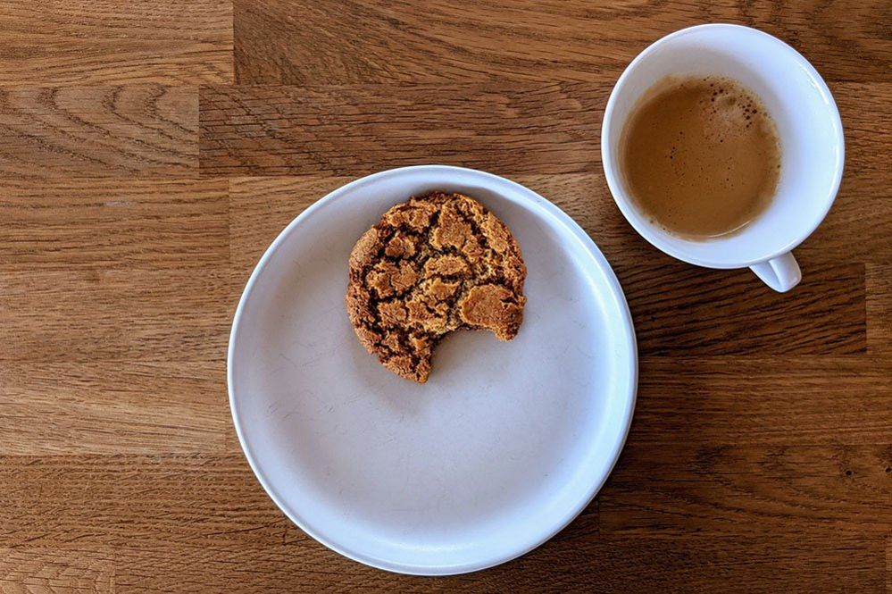 Ginger biscuit and cup of coffee