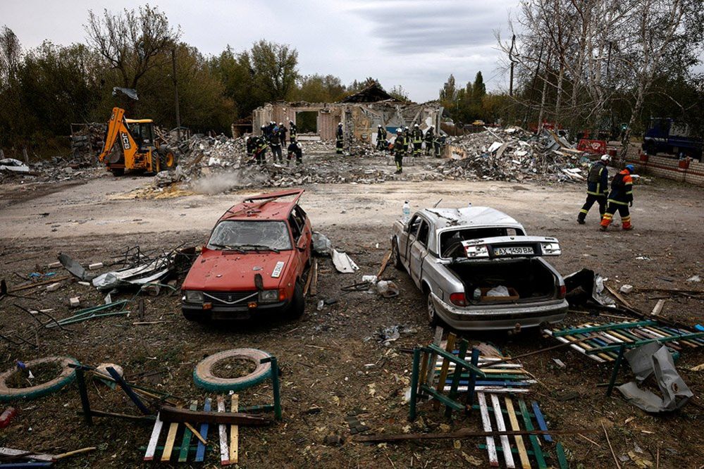 Emergency personnel work in the village of Hroza