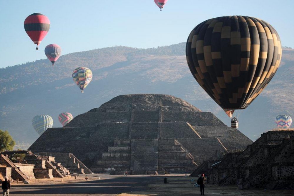 Hot air balloons float above the Pyramid of the Moon on the day of the spring equinox in the pre-hispanic city of Teotihuacan, on the outskirts of Mexico City, Mexico, March 20, 2023.