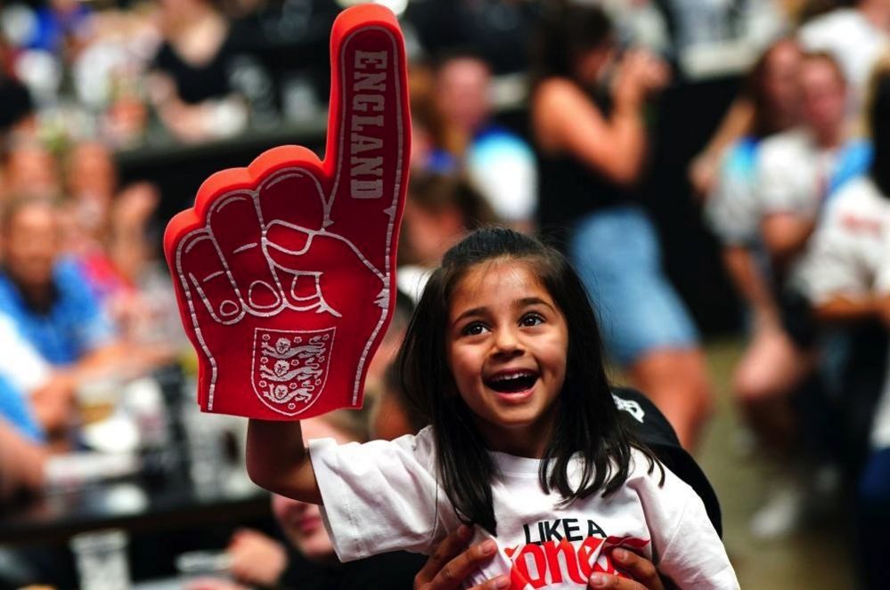 A young England fan during a screening of the FIFA Women's World Cup 2023 semi-final between Australia and England at BOXPARK Wembley