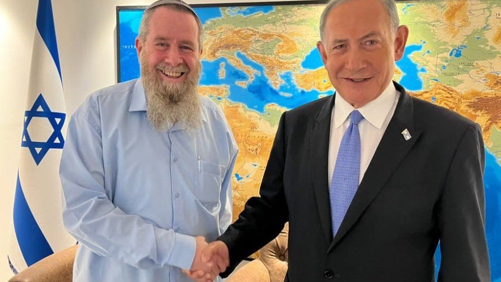 Noam party leader Avi Maoz shakes hands with Likud party leader and Israeli Prime Minister-designate Benjamin Netanyahu on 27 November 2022