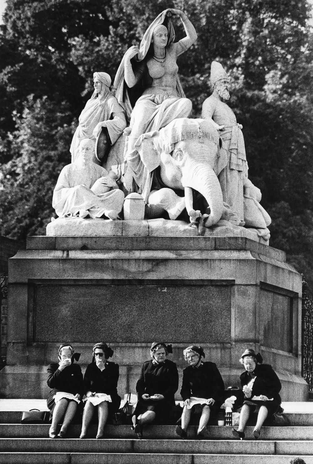 Salvation Army officers on the steps of the figure group Asia, Albert Memorial, Kensington Gardens, London
