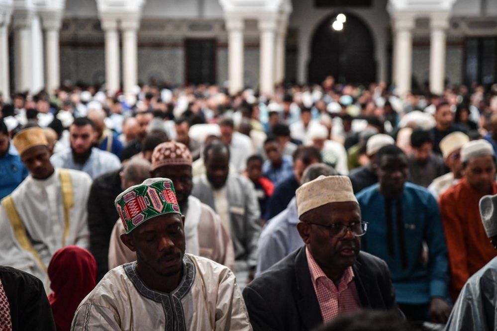 Muslims perform the Eid al-Adha prayer at the Grand Mosque of Paris, France
