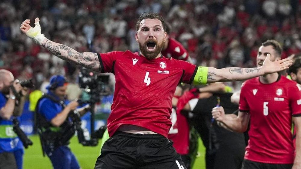 Georgia players celebrate as they beat Portugal