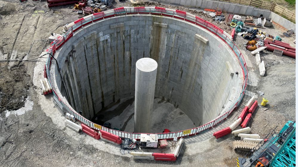 A giant storm overflow tank at Ebley in Gloucestershire. It is a round structure made of concrete and is sunk into the ground