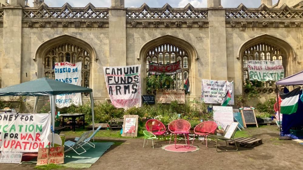 Placards adorn the walls of a Cambridge University college