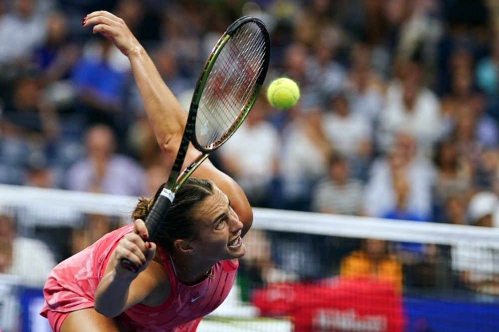 Aryna Sabalenka of Belarus returns a tennis shot to Madison Keys