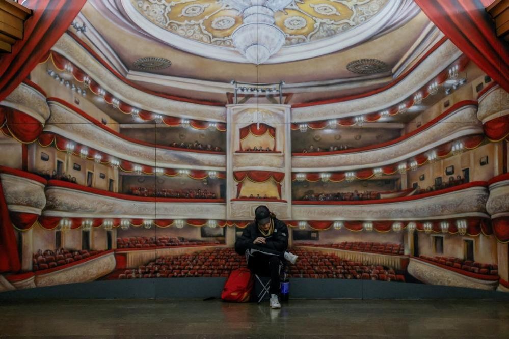 A man takes shelter inside a metro station in Kyiv