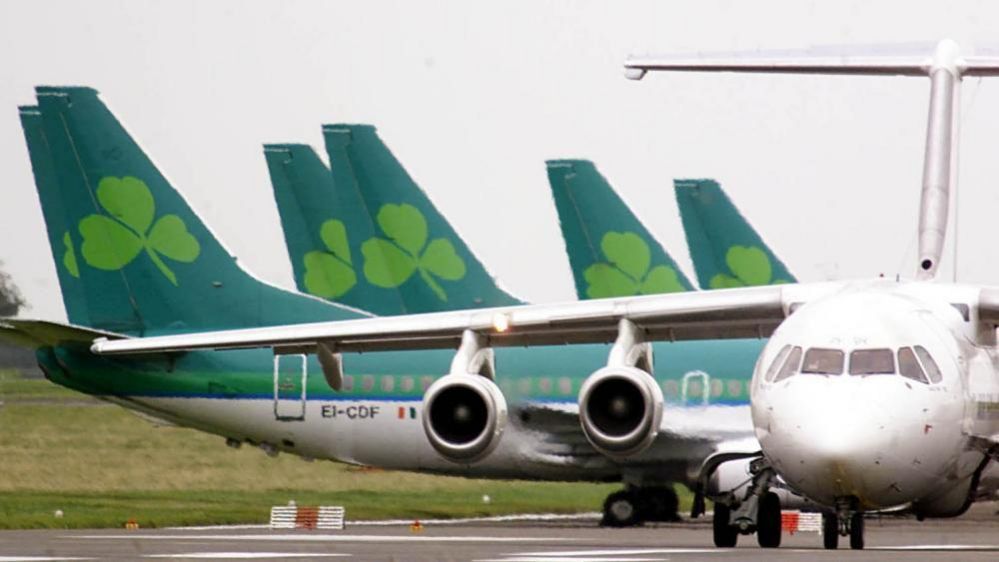 Aer Lingus planes line up behind white plane