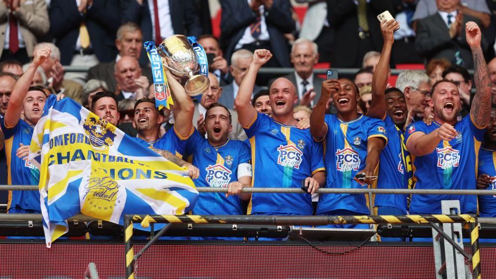 Romford players celebrate winning the FA Vase at Wembley