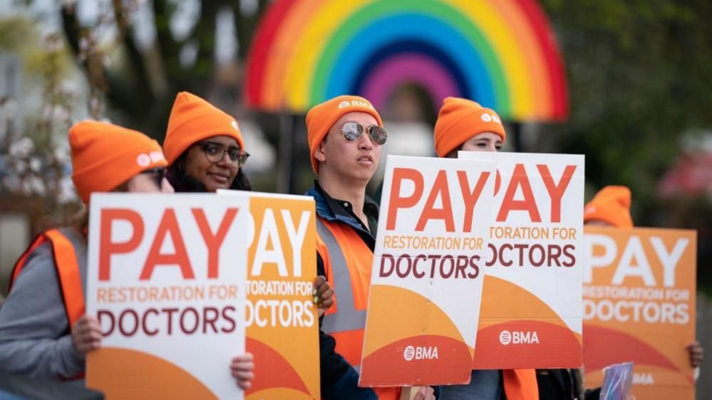 Junior doctors holding placards