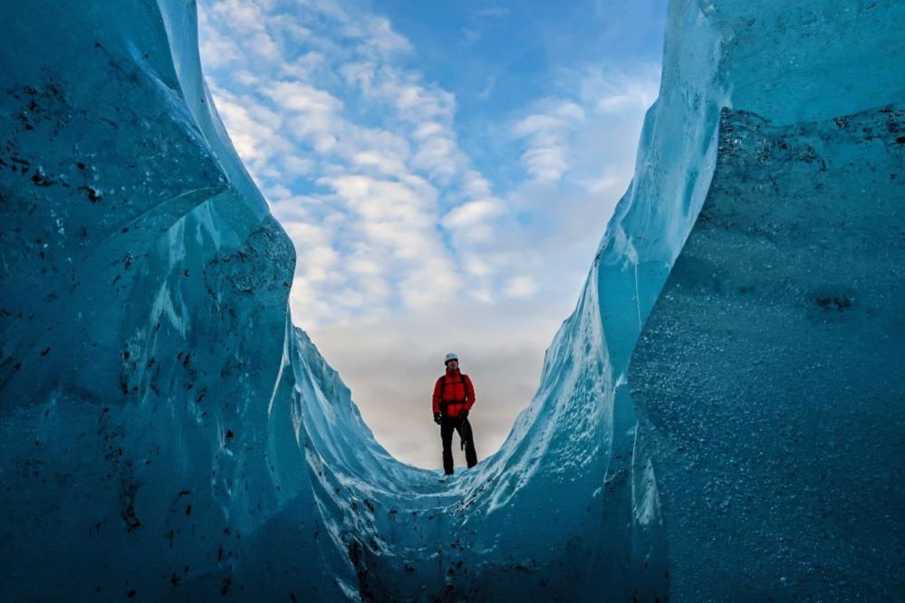 A man inside a glacier