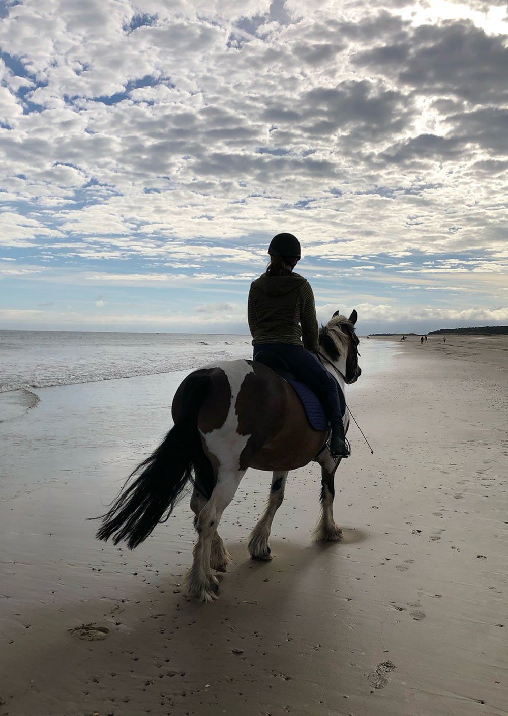 Riding a horse on the beach at Holkham