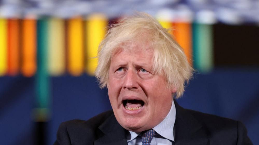 Boris Johnson with mout open