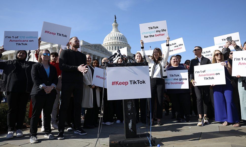 Participants hold up signs in support of TikTok at a news conference outside the U.S. Capitol Building on March 12, 2024 in Washington, DC