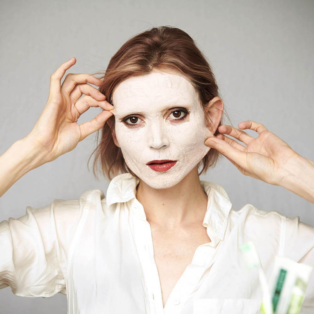 Woman with a face mask applied