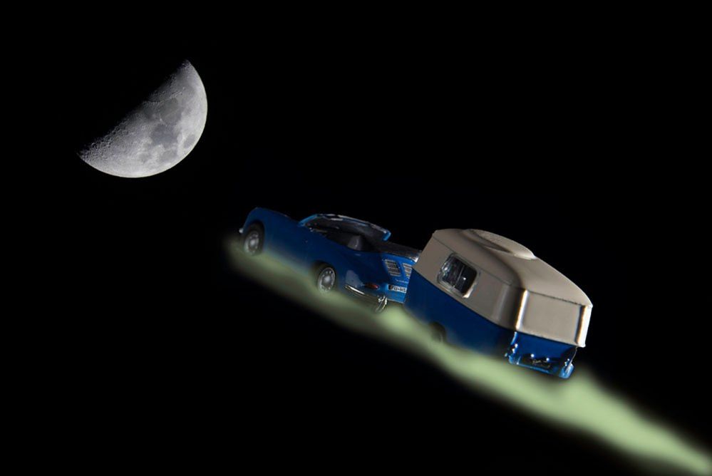 Model car and caravan heading for the moon