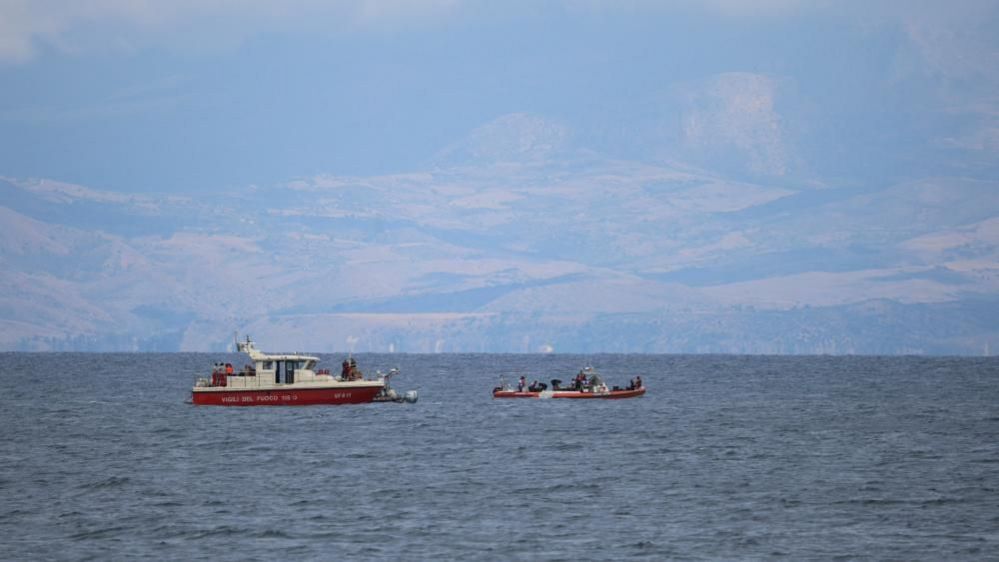 Two red  boats at sea