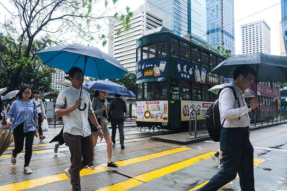 Pedestrians walk in central Hong Kong in October 2023