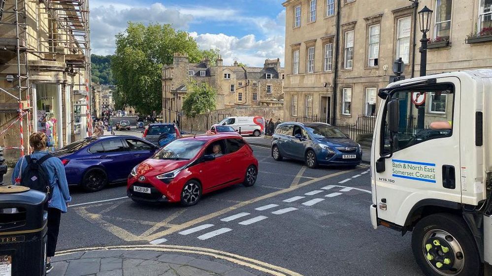 The busy Gay Street junction in Bath, with a five vehicles visable