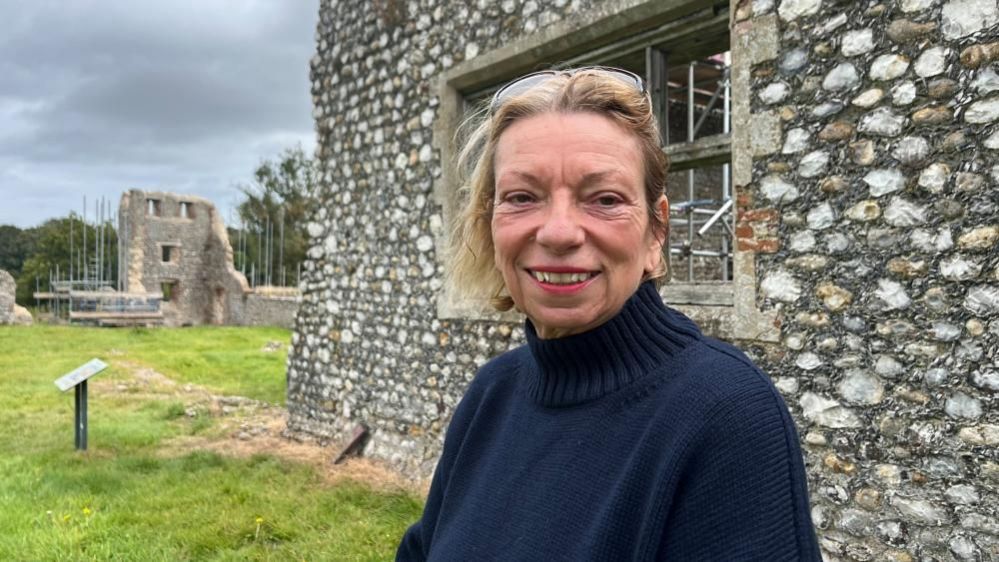 Jo Brannigan standing near the wool factory, which is part of Baconsthorpe Castle