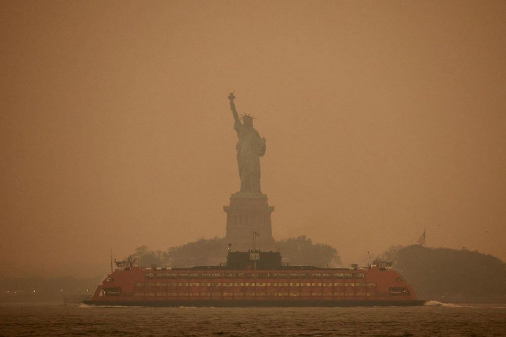 The Statue of Liberty is covered in haze and smoke caused by wildfires in Canada