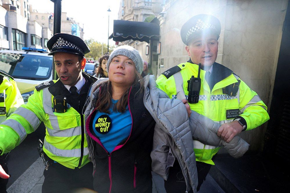 Police officers detain Swedish climate campaigner Greta Thunberg, during an Oily Money Out and Fossil Free London protest, 17 October 2023