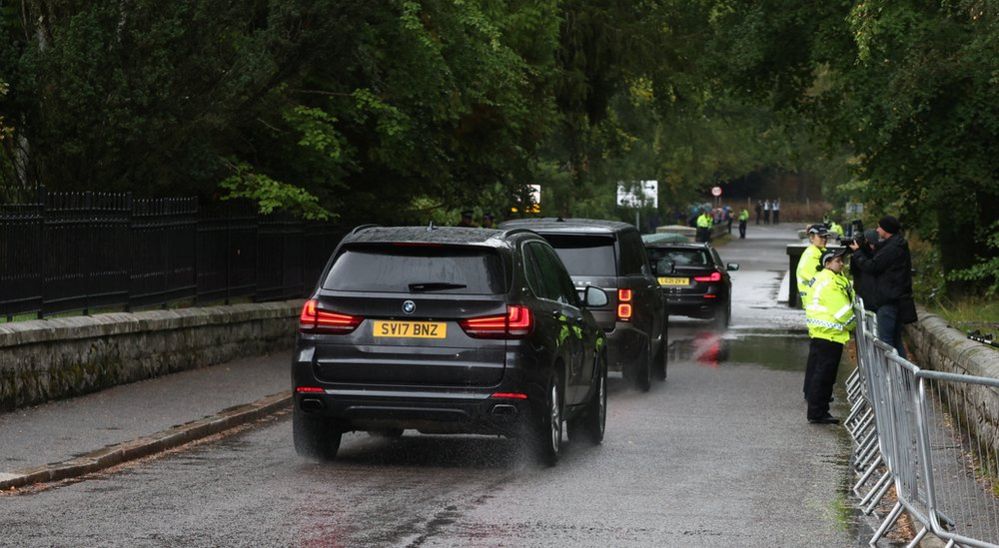 A motorcade of cars heading to Balmoral