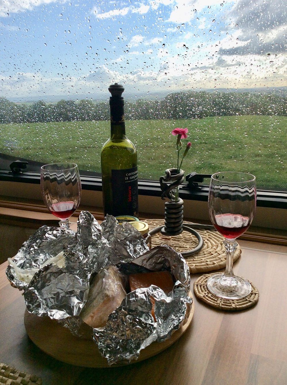 Wine in the window of a caravan