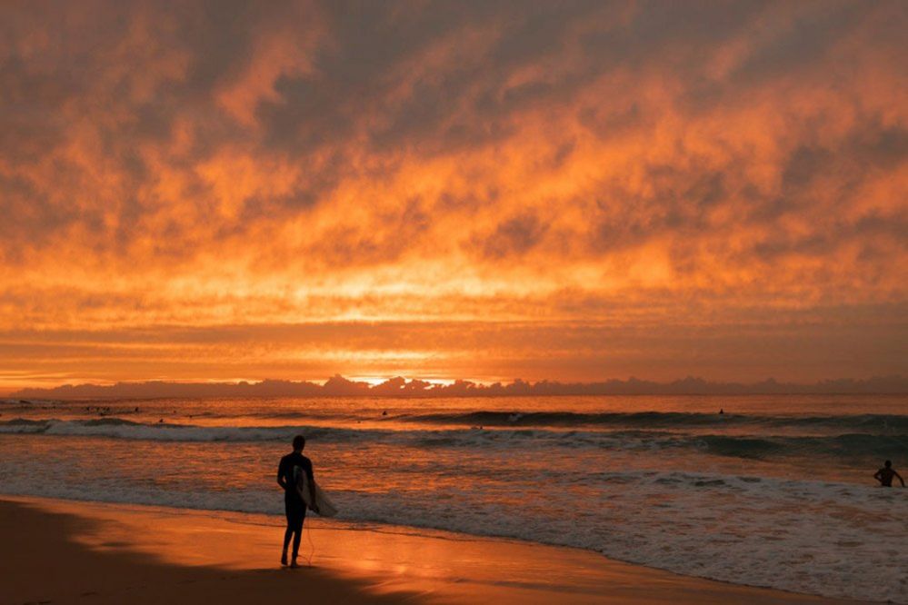 A surfer waits to paddle out at Maroubra beach in Sydney, Australia