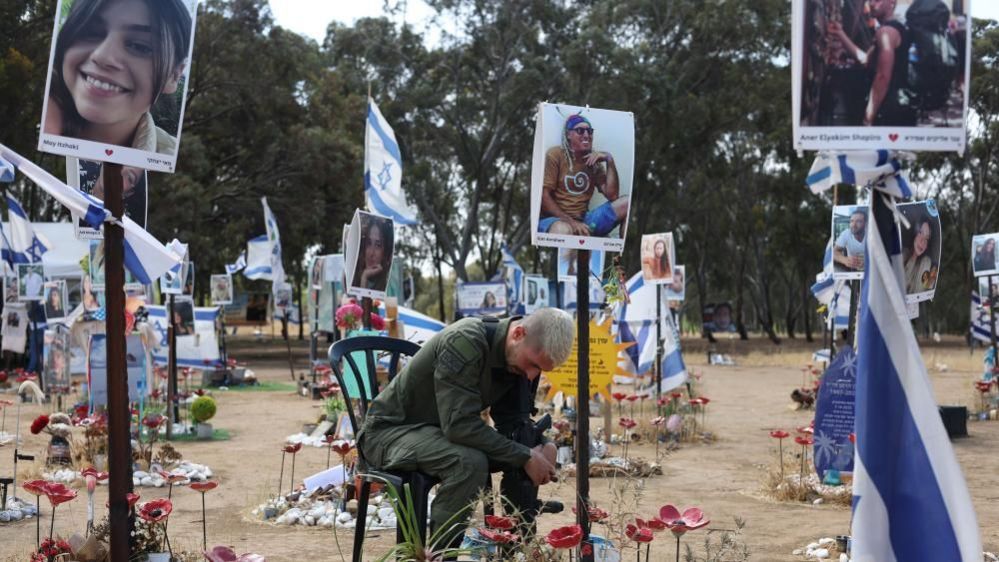 Mourner at site of Nova festival massacre (13/05/24)