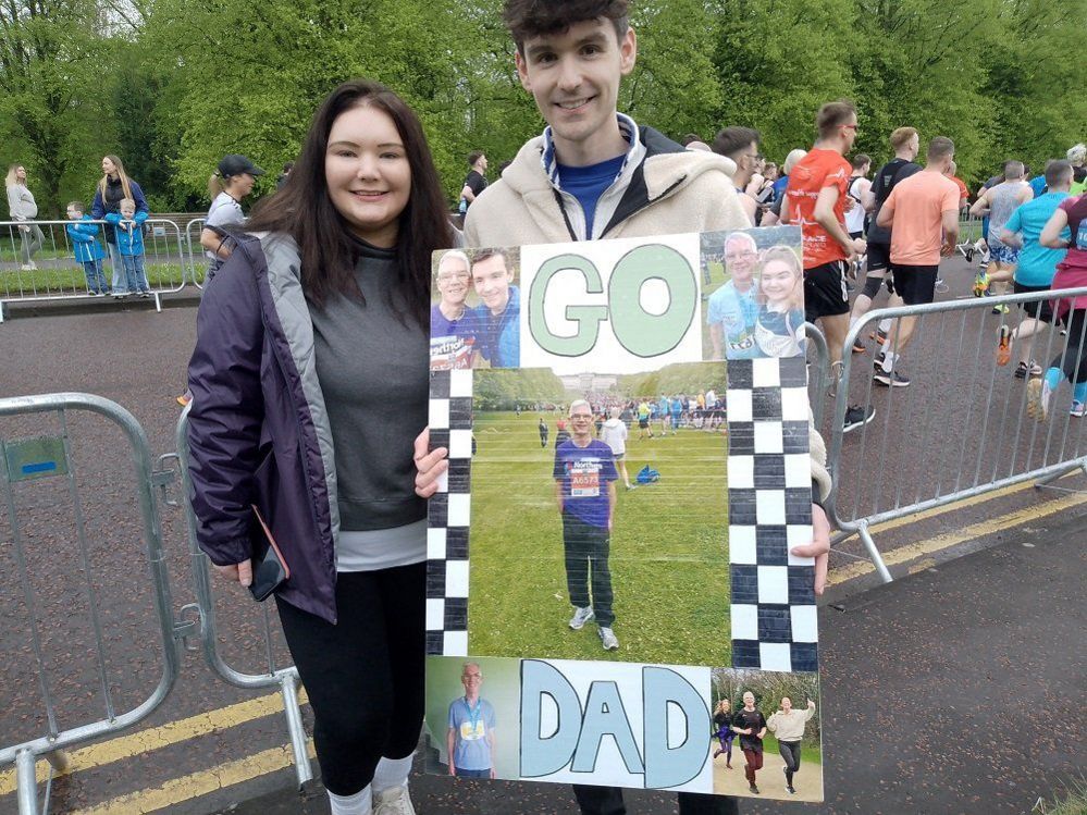Andrew Gorman and sister Jennifer cheering on dad - 62-year-old Jackie at marathon