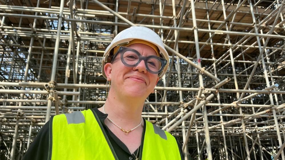 Architect Faye Davies pictured next to scaffolding inside the Winter Gardens