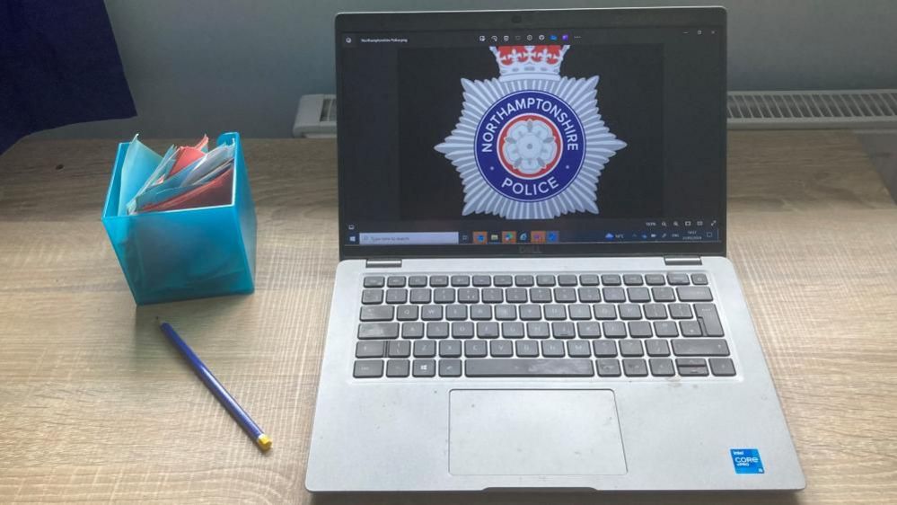 Laptop with Northamptonshire Police logo showing