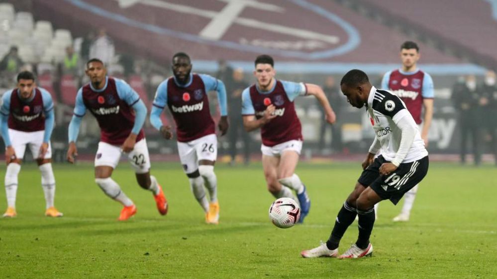 Ademola Lookman chips a 'Panenka' penalty, which was easily saved by Lukasz Fabianski in the West Ham goal