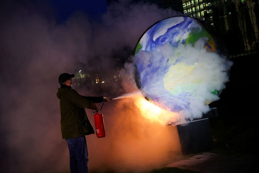 A demonstrator takes part in a protest against the fossil fuel industry in Frankfurt, Germany